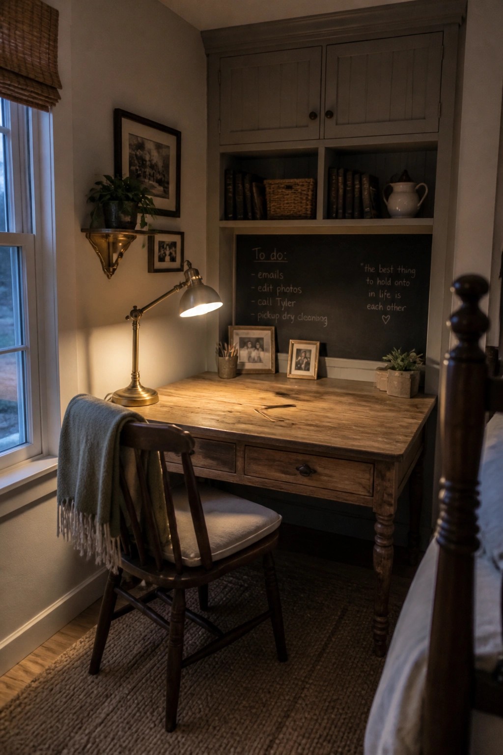 Cozy wooden desk with lit brass lamp, chair with green blanket, and chalkboard to-do list.